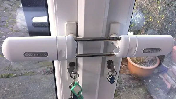 A Patlock is securing a white French door