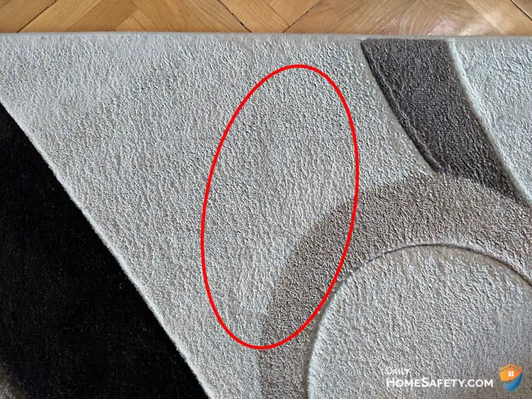 A footprint on a rug