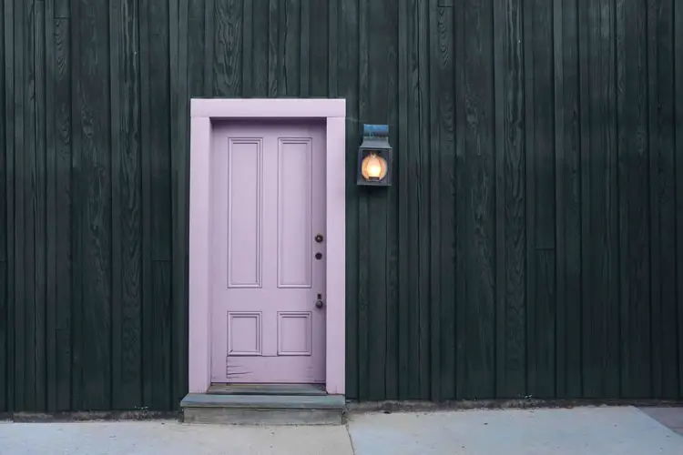 Languid lavender door and dark gray walls