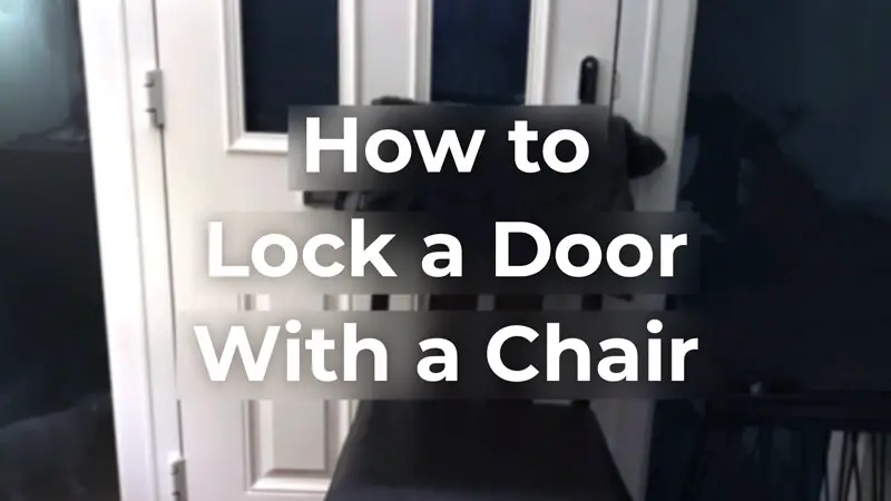 A white door locked with a chair from the inside