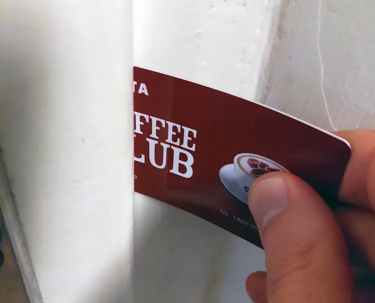 Inserting a plastic card between a door and a door frame