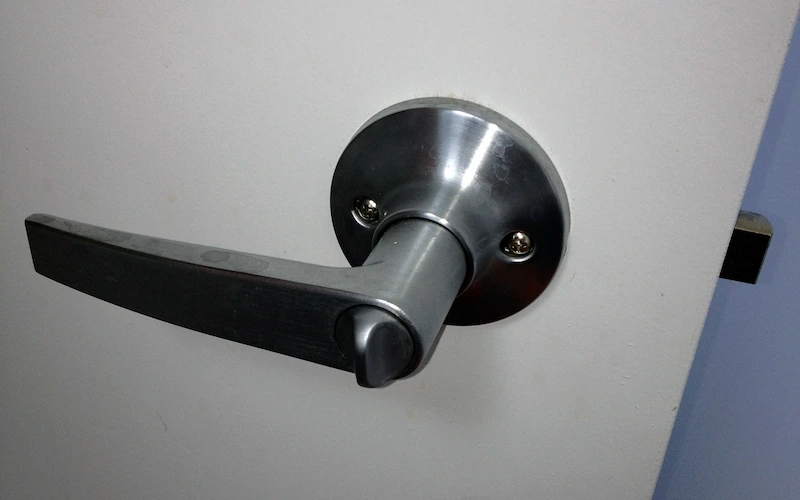 Privacy handle installed on a white door